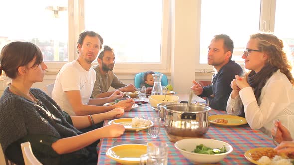 Group Of Friends Eating Lunch At Home 6