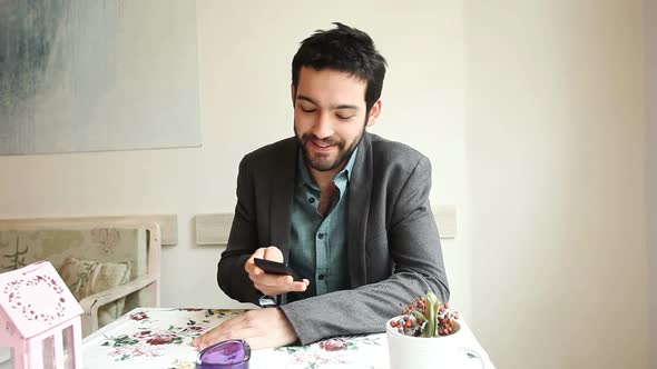 Handsome Young Man Answering A Call