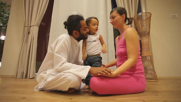 Couple With Baby In Yoga Centre 1 alt
