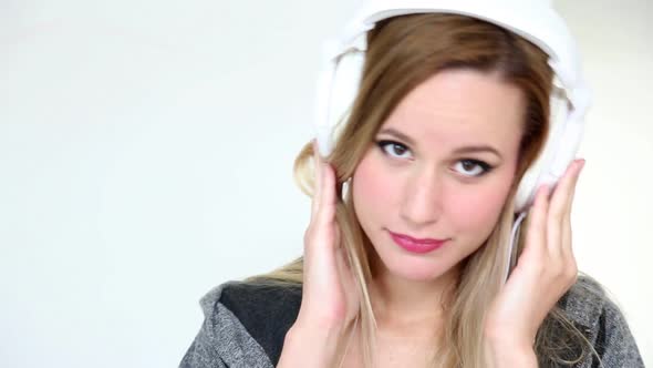 Beautiful Young Blond Woman Dancing With White Headphones 12