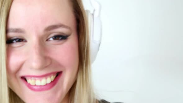 Beautiful Young Blond Woman Dancing With White Headphones 22 alt