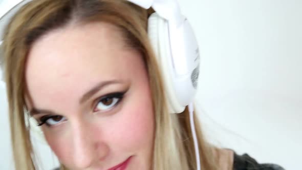 Beautiful Young Blond Woman Dancing With White Headphones 23 alt