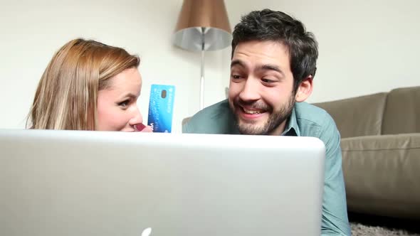 Woman And Man Lying On Carpet In Living Room And Buying Online 2 alt