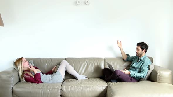 Woman And Man Sitting On Couch And Relaxing 2