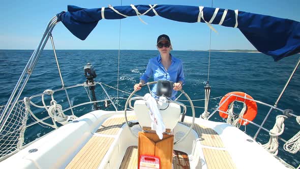 Woman At Wheel Steering Sailboat On Adriatic Sea In Croatia 1