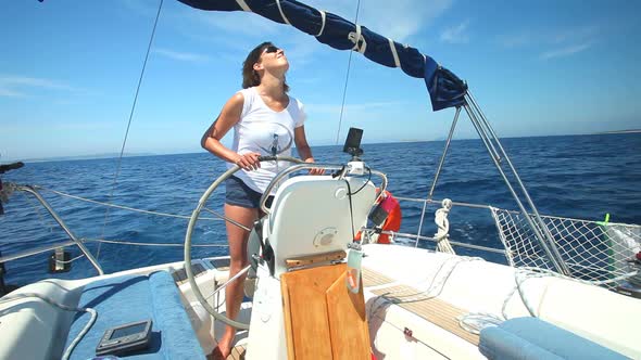 Woman At Wheel Steering Sailboat On Adriatic Sea In Croatia 2