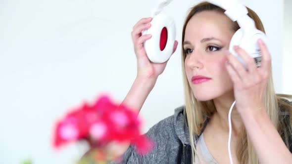 Beautiful Young Blond Woman Listening To Music On Laptop With White Headphones 14 alt