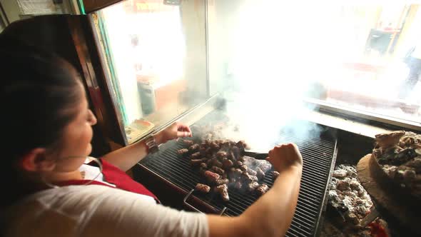 Woman Barbecuing Meat 2