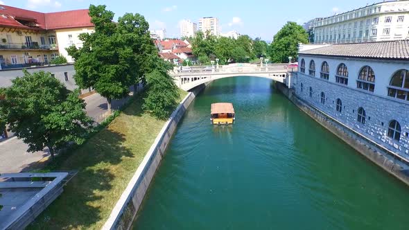 Aerial View Of Bridge And Boat On The River Ljubljanica In Ljubljana, Slovenia 1