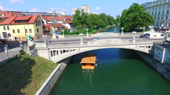 Aerial View Of Bridge And Boat On The River Ljubljanica In Ljubljana, Slovenia 2