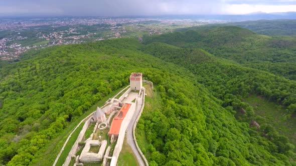 Aerial View Of Fort Medvedgrad With Forest Around It And Cityscape In Distance. 10