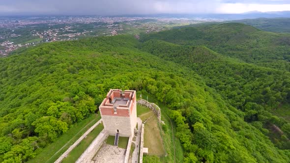 Aerial View Of Fort Medvedgrad With Forest Around It And Cityscape In Distance. 13