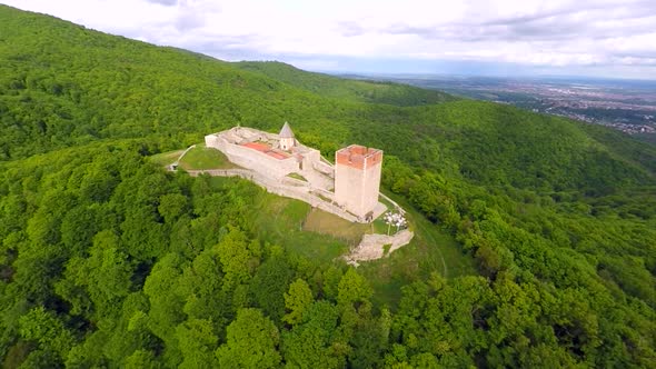 Aerial View Of Fort Medvedgrad With Forest Around It And Cityscape In Distance. 2