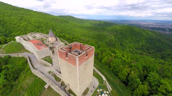 Aerial View Of Fort Medvedgrad With Forest Around It And Cityscape In Distance. 5 alt