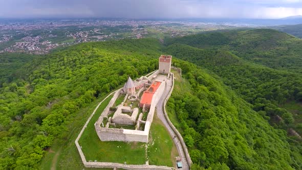 Aerial View Of Fort Medvedgrad With Forest Around It And Cityscape In Distance. 7
