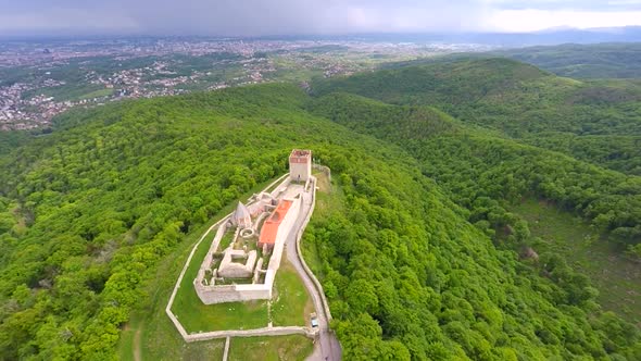 Aerial View Of Fort Medvedgrad With Forest Around It And Cityscape In Distance. 9