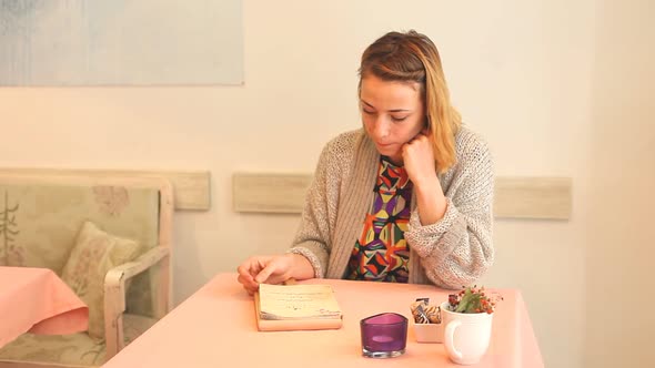 Beautiful Young Woman Reading The Menu In A Cafe 1