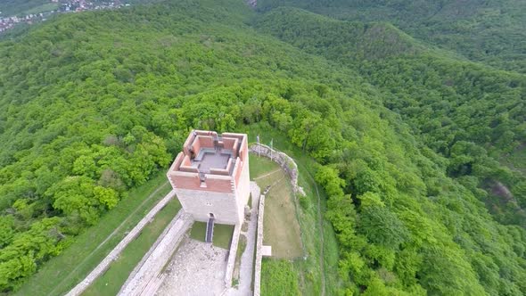 Aerial View Of Medvedgrad Tower With Forest Around It And Cityscape In Distance. 1