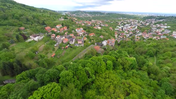 Aerial View Of Mount Medvednica Forest And Cityscape In Distance.