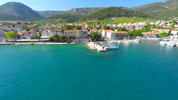 Aerial View Of Small Lighthouse In Bol Harbour On The Island Of Brac, Croatia. 2