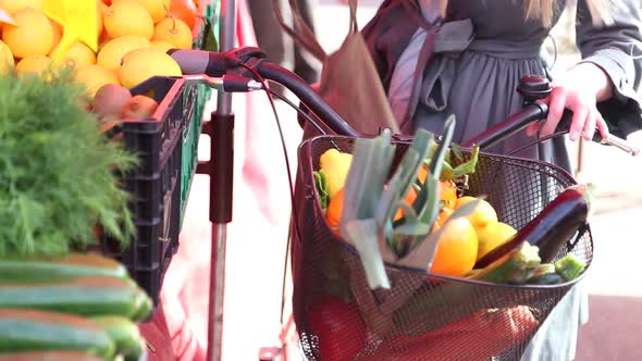 Blonde Girl At The Market Picking Fruit 2