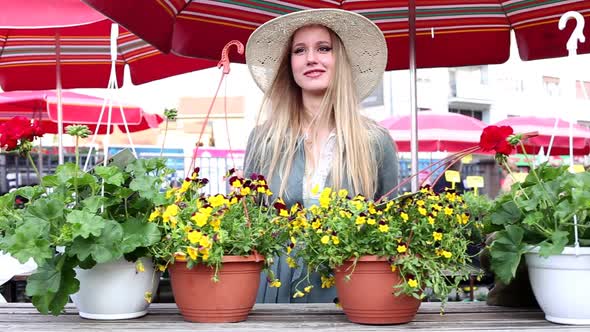 Blonde Girl Standing In The Market, Smiling alt
