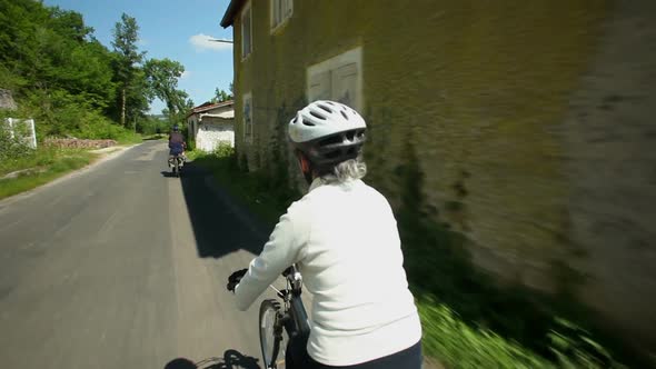 Slow Motion - Woman Cycling On Road In Countryside 1