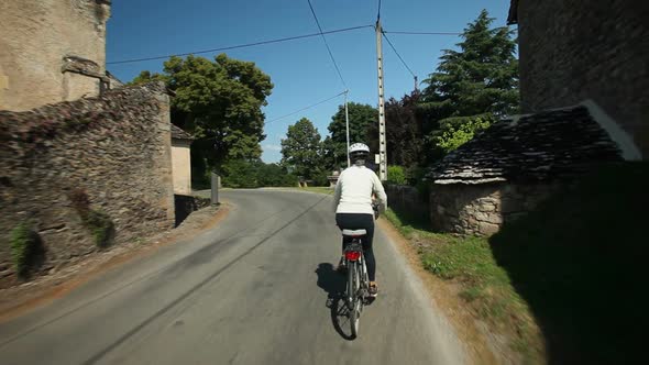 Slow Motion - Woman Cycling On Road In Countryside 3