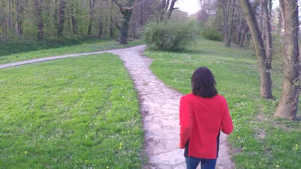 Slow Motion Of Man Running Down The Pathway In Park. 2