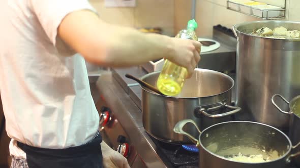 Chef Cooking In Kitchen