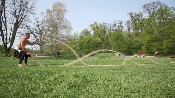 Sports Man Is Training With Ropes 3