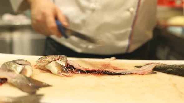 Chef Cutting Fish In Restaurant 6