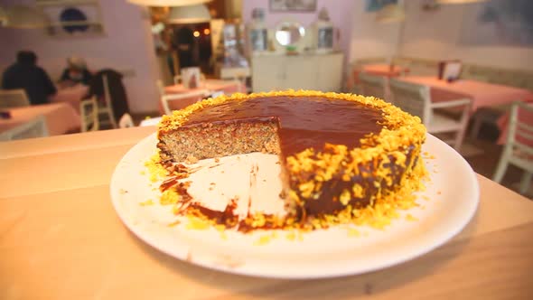 Chocolate Cake In Restaurant Interior 3 alt
