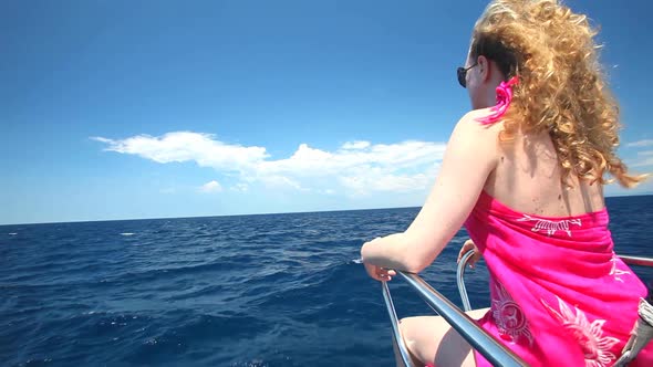 Woman Sitting On Bow Of Sailing Boat Enjoying View Of Sea 8