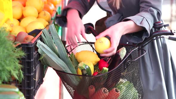 Close Up Of A Bike With Basket, Full Of Fruit And Vegetables