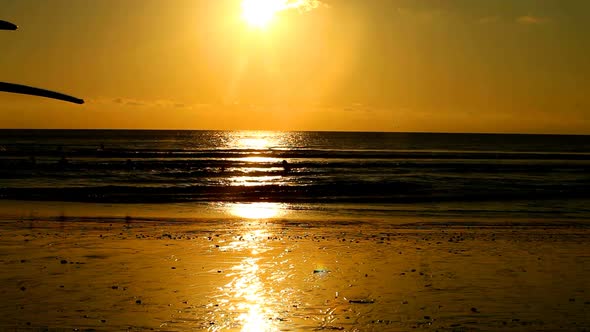 Surfers At Sunset 1