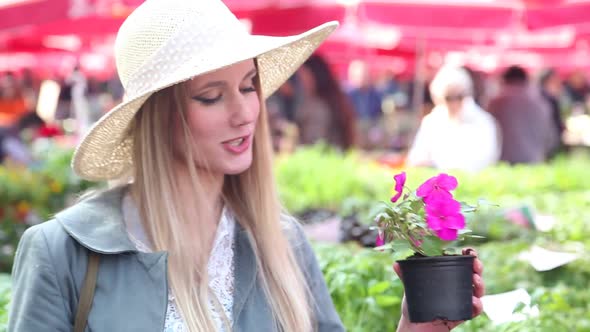 Close Up Of A Girl Holding And Smelling Flowers 1