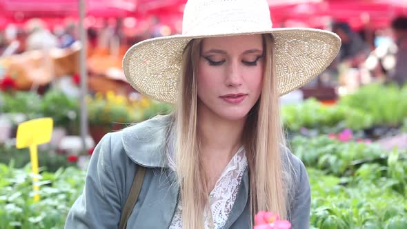 Close Up Of A Girl Smelling Flowers 1 alt