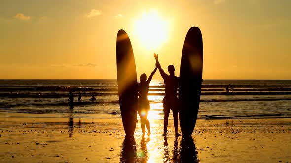 Surfers At Sunset 3
