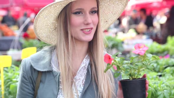 Close Up Of A Girl Smelling Flowers 4 alt