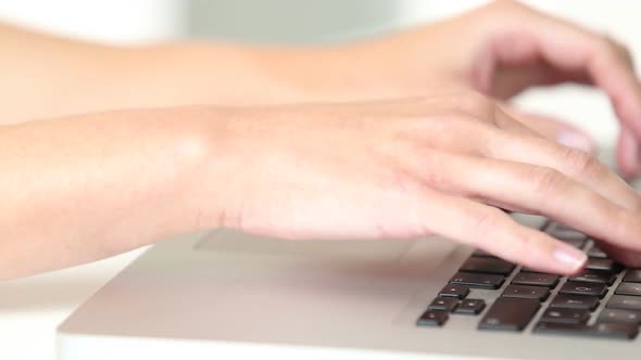 Womans Hands Typing On Laptop Keyboard 1