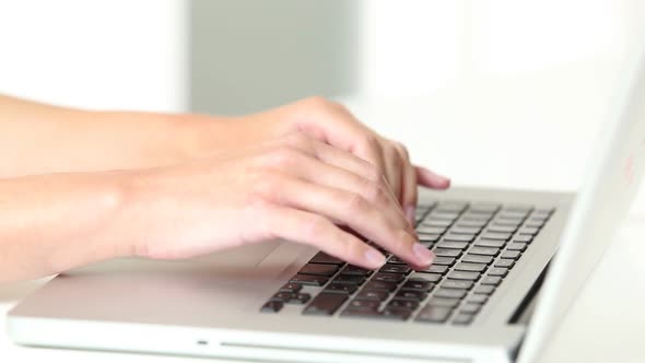 Womans Hands Typing On Laptop Keyboard 6