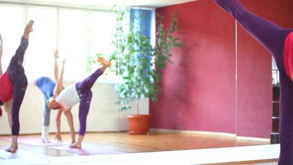 Women Doing Yoga Class In Hall 28
