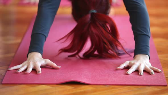 Women Doing Yoga Class In Hall 4