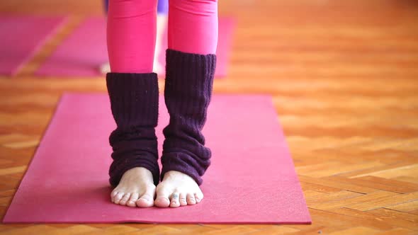 Women Doing Yoga Class In Hall 5 alt