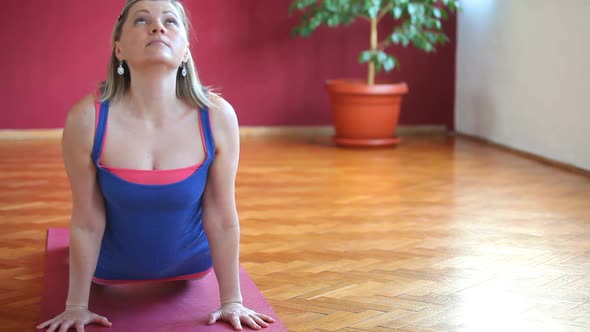 Women Doing Yoga Class In Hall 7