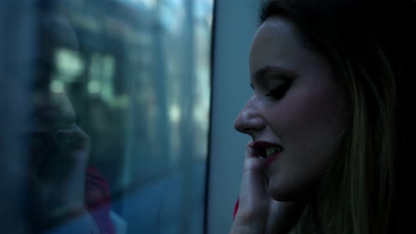 Young Blond Woman Riding Tram And Talking On Mobile, Phone, Cell 3