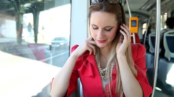 Young Blond Woman Riding Tram, Talking On Mobile, Phone, Cell 4