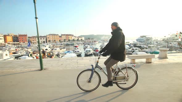 Man Cycling On Road In Rovinj, Croatia. 4