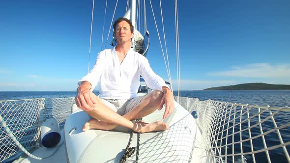 Man Enjoying Sailing Trip On Boat 2 alt